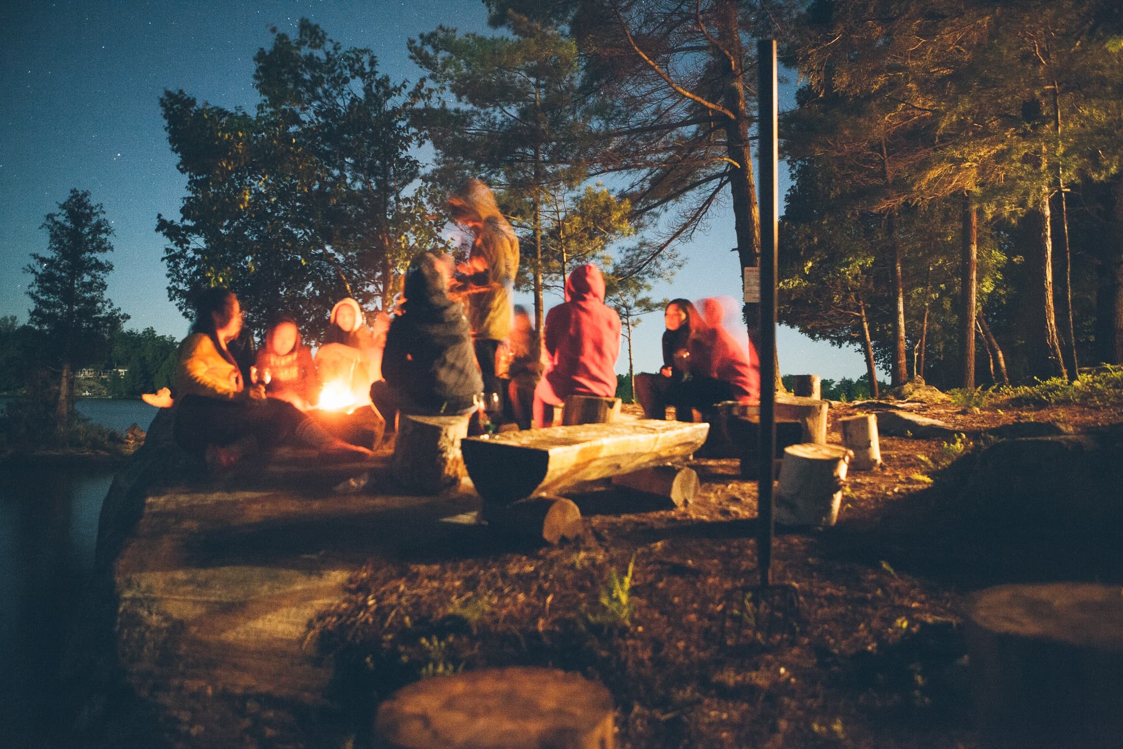 couple using a laptop in a camping tent