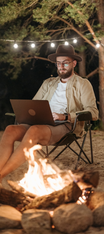 guy camping with a laptop